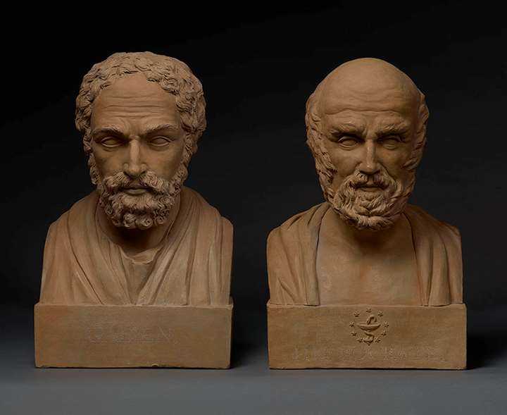 A pair of terracotta busts of Galen and Hippocrates